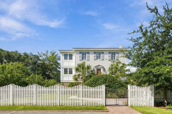 Two-story white home behind a picket fence at 41 Barre Street, Charleston