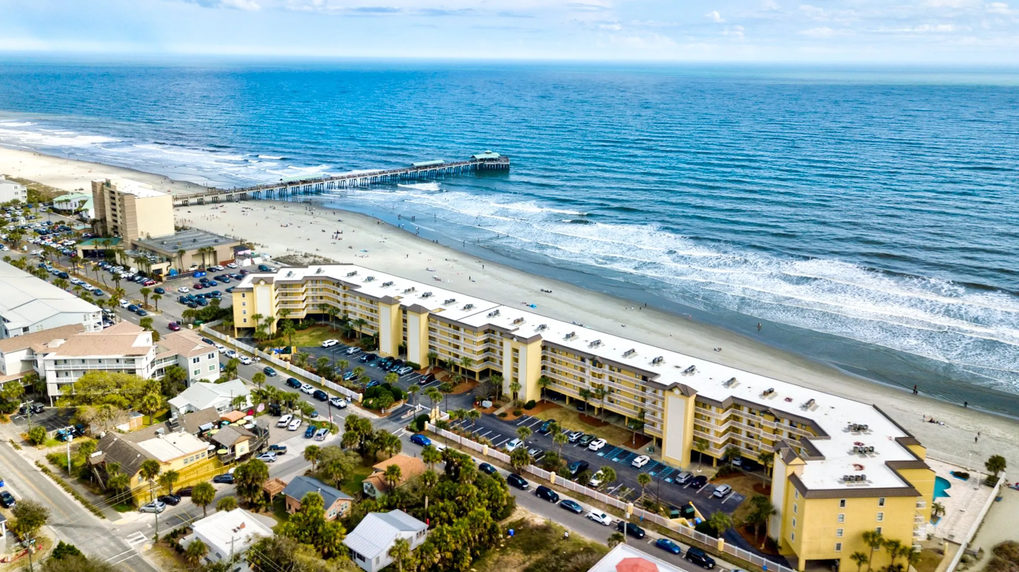 Aerial view of Folly Beach oceanfront buildings and the Atlantic